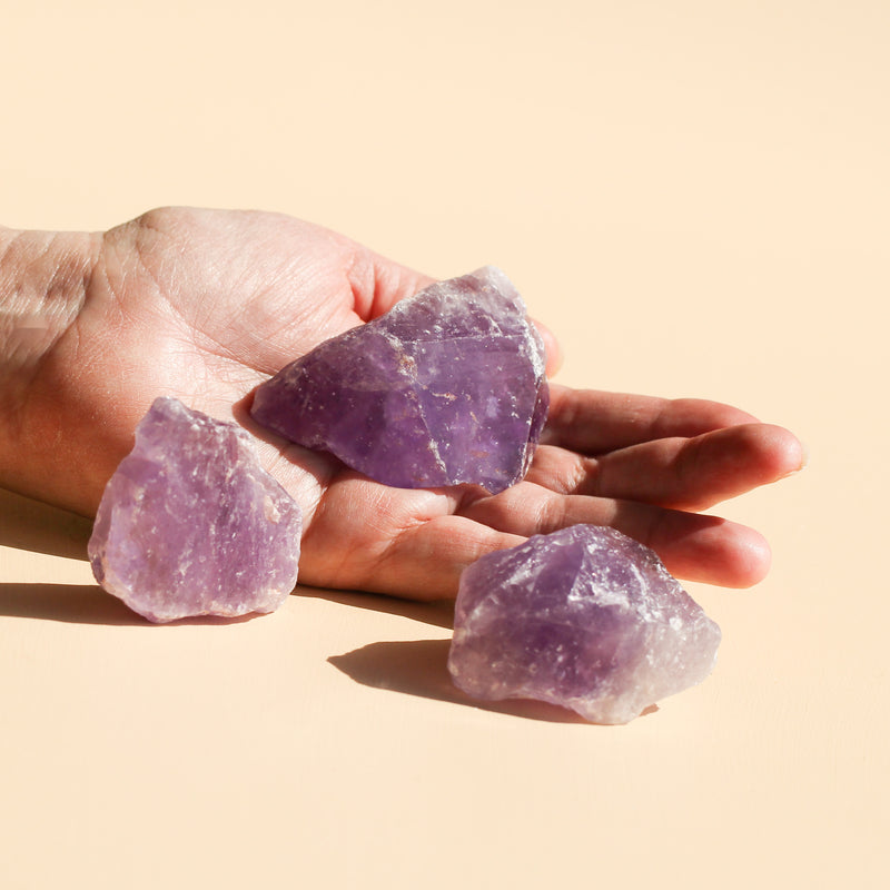 One Amethyst Chunk on the palm of a hand