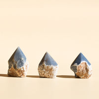 Three straight-aligned Angelite half-polished points