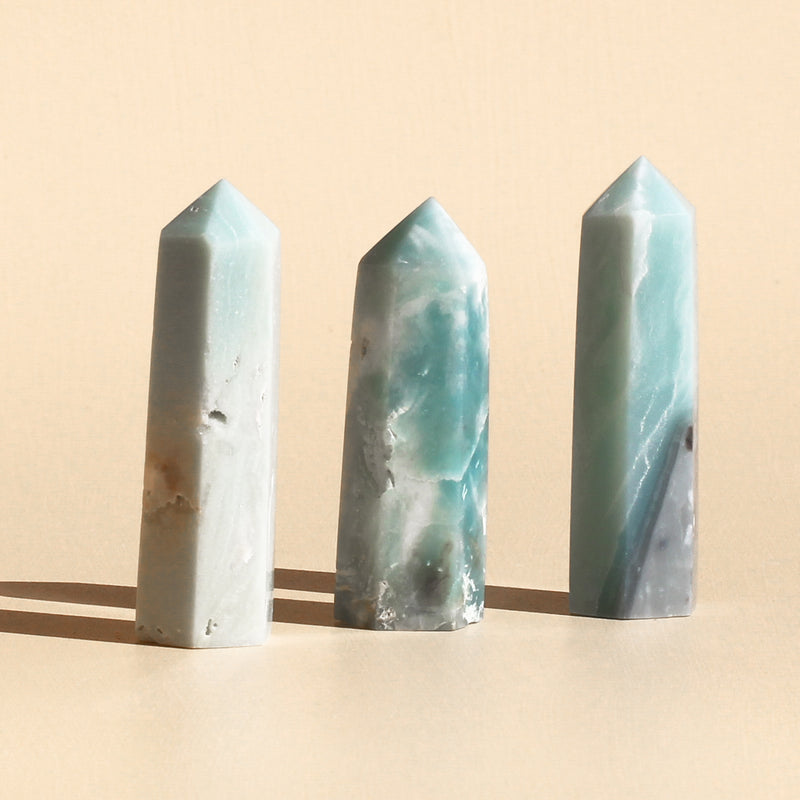 Close-up photo of three Amazonite points in the shade of turquoise or green