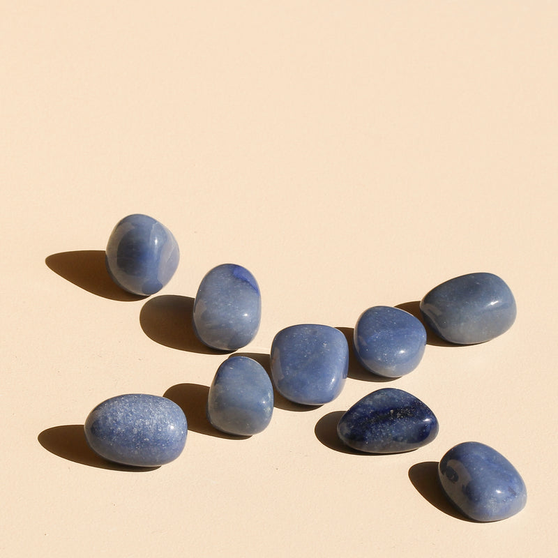 Blue Quartz Tumbles arranged in intersecting diagonals