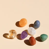 Crystal Chakra in variations of red aventurine, orange calcite, golden calcite, green aventurine, blue quartz, purple amethyst, and clear quartz