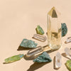 This set includes 1 medium Citrine Point (5-6cm), 6 polished Clear Quartz points, 4 Fuschite pieces (2-3cm), and 4 Aura Quartz necklace points, combining prosperity, clarity, and healing energies