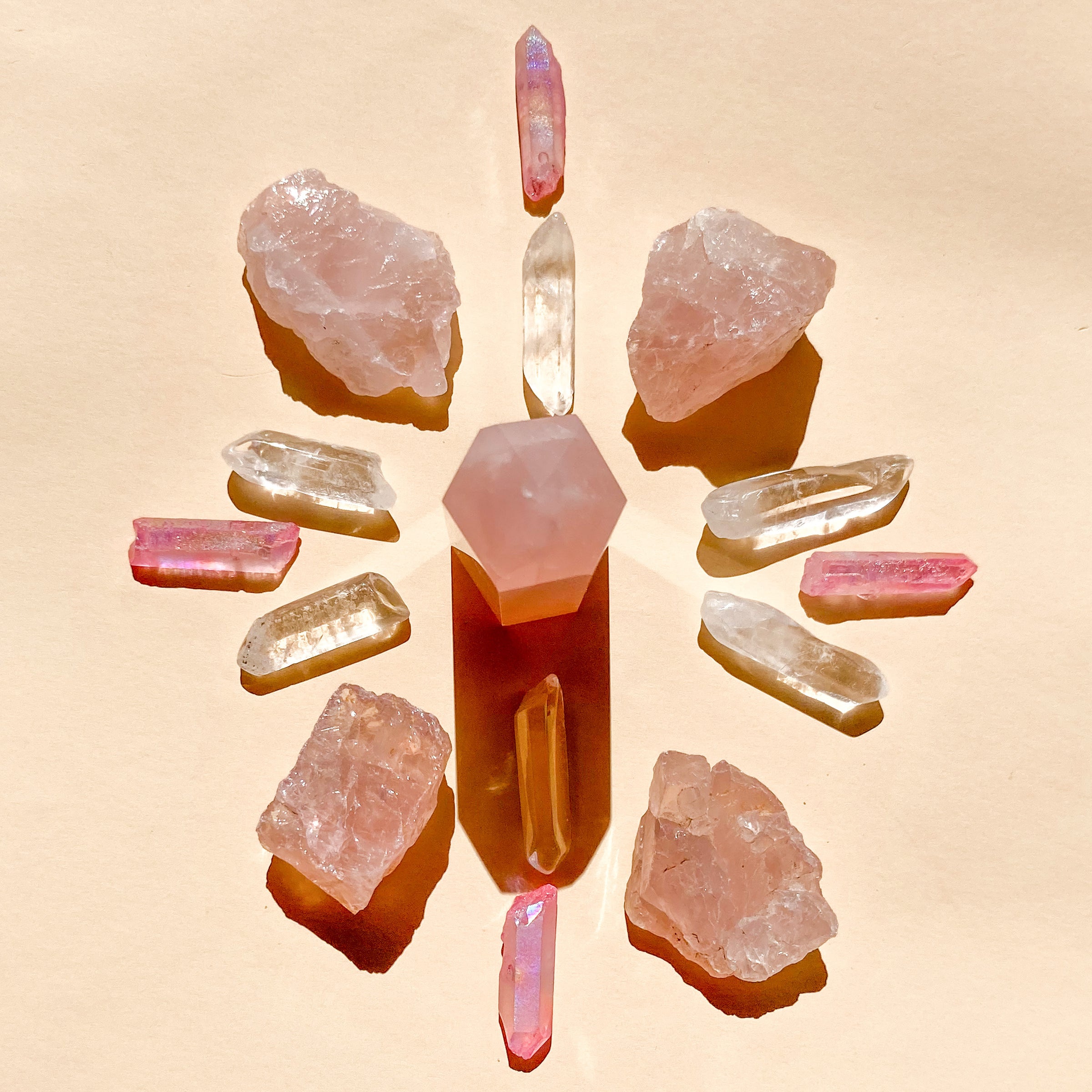 This bundle contains 1 medium Rose Quartz Point (5-6cm), 6 polished Clear Quartz points, 4 rough Rose Quartz chunks (2-4cm), and 4 Pink Aura Quartz necklace points, offering a harmonious blend of love and clarity