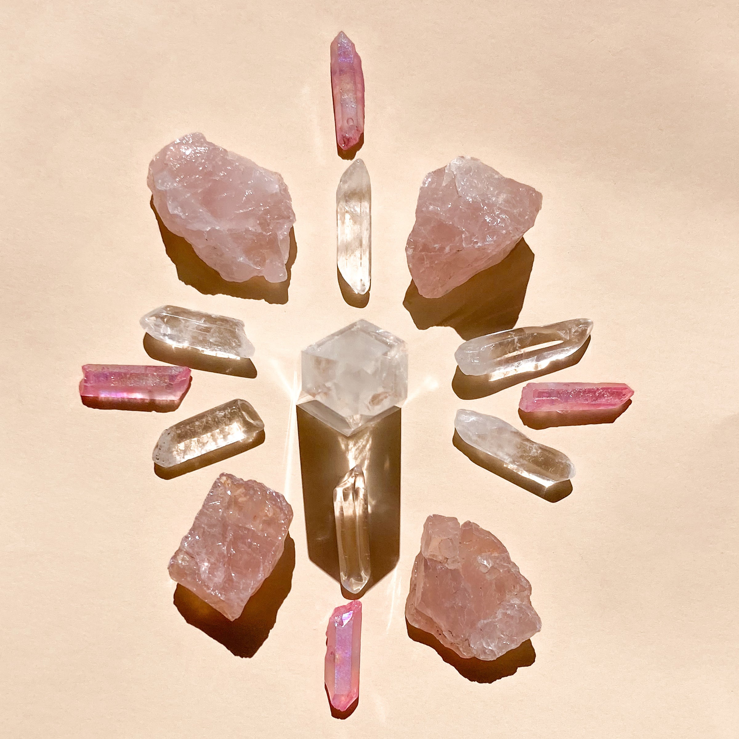 I Am Love & Light which contains 1 medium Rose Quartz Point (5-6cm), 6 polished Clear Quartz points, 4 rough Rose Quartz chunks (2-4cm), and 4 Pink Aura Quartz necklace points, offering a harmonious blend of love and clarity