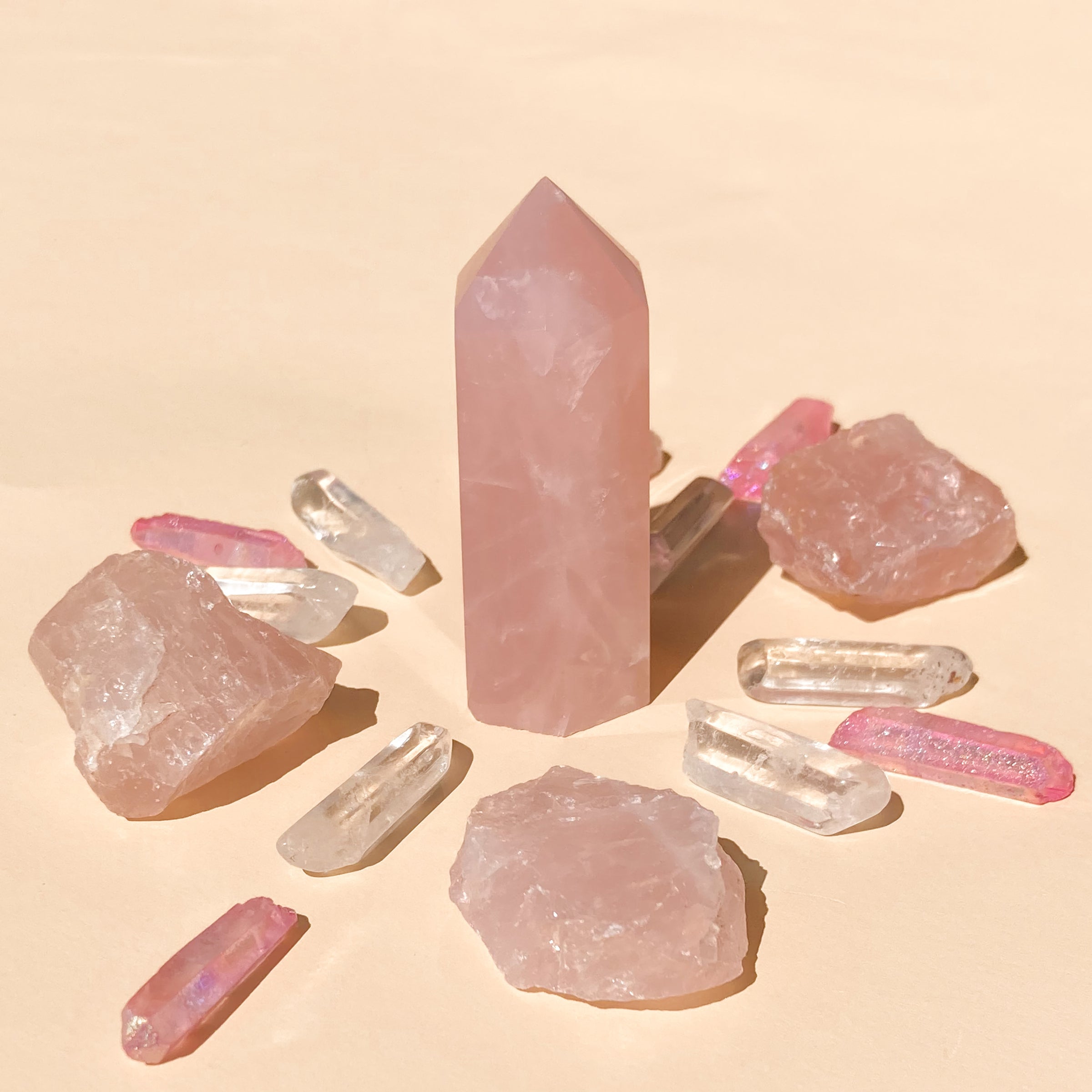 I Am Love & Light which contains 1 medium Rose Quartz (5-6cm), 6 polished Clear Quartz points, 4 rough Rose Quartz chunks (2-4cm), and 4 Pink Aura Quartz necklace points, offering a harmonious blend of love and clarity