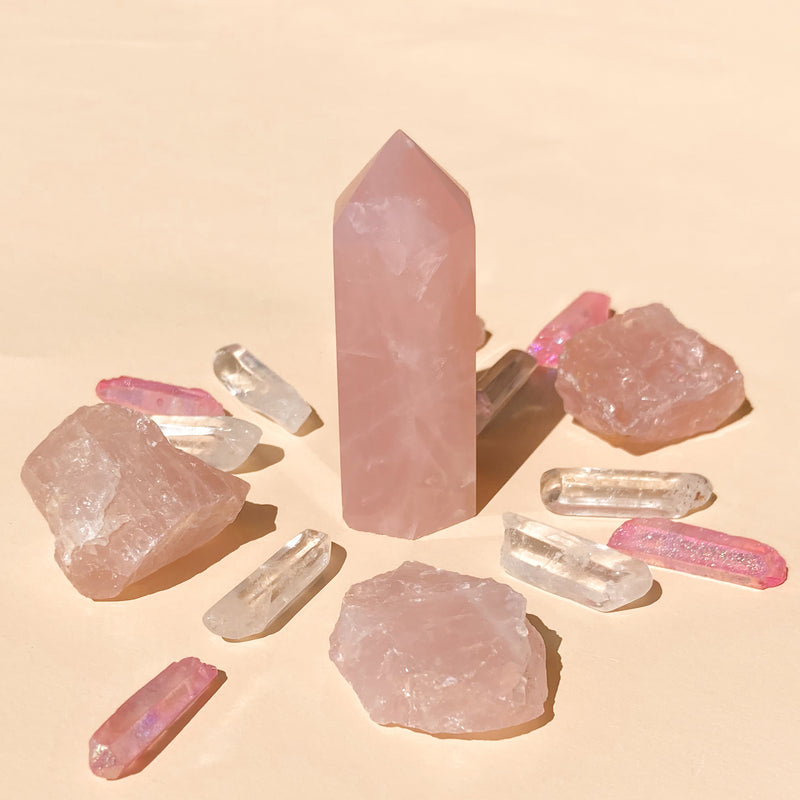 I Am Love & Light which contains 1 medium Rose Quartz (5-6cm), 6 polished Clear Quartz points, 4 rough Rose Quartz chunks (2-4cm), and 4 Pink Aura Quartz necklace points, offering a harmonious blend of love and clarity