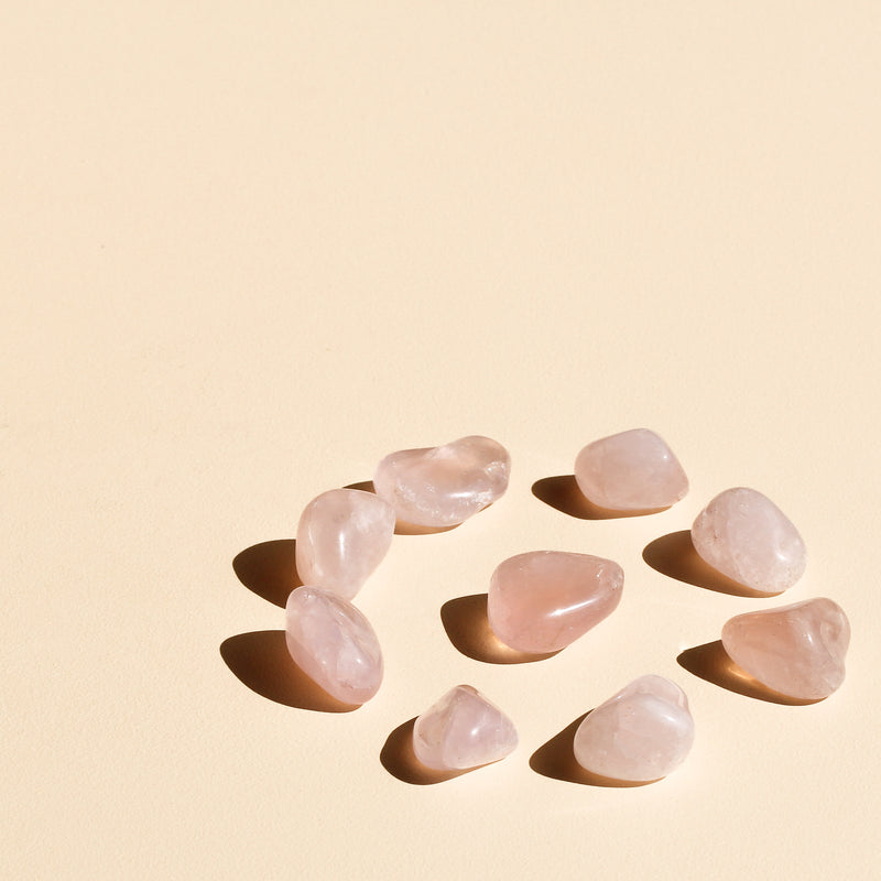 Rose Quartz Tumbles in a circle with one tumble in the centre